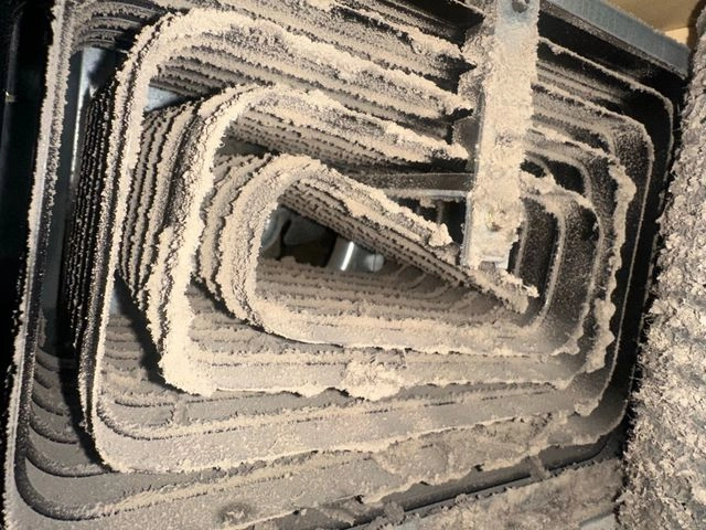 Dryer heating element coils before cleaning and repair