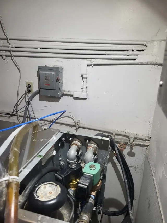 Commercial ice maker internal repair work in progress