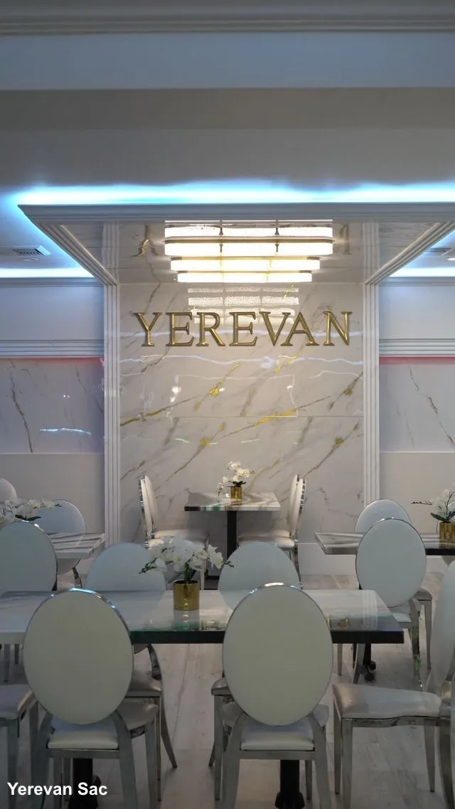 Elegant and inviting interior of Yerevan Sac's dining room in Carmichael. The refined atmosphere with warm lighting and comfortable seating sets the stage for an authentic Armenian and Georgian dining experience, perfect for families and groups.