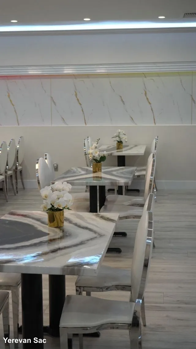 Yerevan Sac restaurant's vibrant interior dining experience. An inviting and lively atmosphere inside Yerevan Sac, featuring stylish decor and comfortable seating arrangements, perfect for enjoying Armenian and Georgian cuisine.