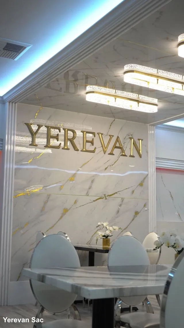 Warm and inviting interior of Yerevan Sac restaurant with dining tables
