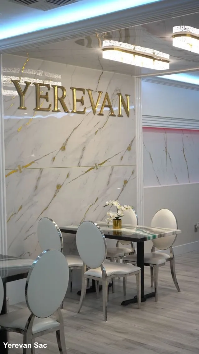 Yerevan Sac Restaurant Interior Dining Area Carmichael. The interior of Yerevan Sac restaurant, showcasing a warm and inviting dining area with natural light, comfortable seating, and elegant decor, creating a pleasant atmosphere for guests.