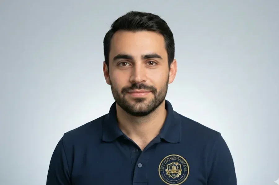 Max, Certified Technician and Part Installer, holding a replacement appliance component ready for installation.