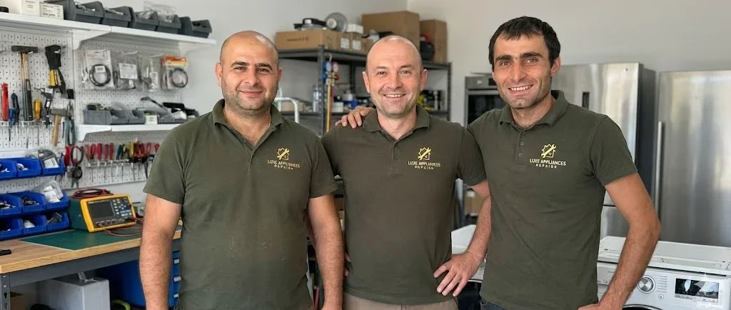 Licensed technician performing expert dishwasher repair service in a clean Rancho Cordova kitchen.